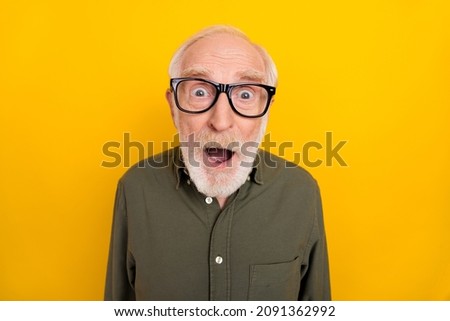 Portrait of impressed aged man open mouth staring camera cant believe isolated on yellow color background Royalty-Free Stock Photo #2091362992