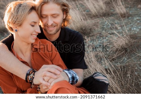 
happy and loving couple in the setting sun
