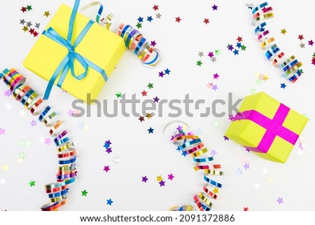 Colorful confetti and presents on white  background text place - Image 
