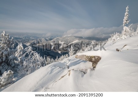 Beautiful  view of the snow-capped mountains. European beautiful winter Carpathians. Natural landscape with beautiful sky. A popular place for hiking and traveling.