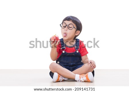 Little boy holding red apple 