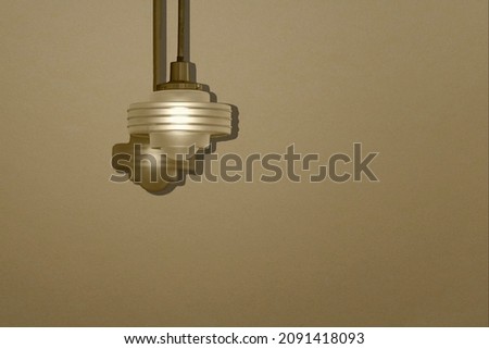 Enhanced photo of a hanging light fixture to use for backgrounds with copy space