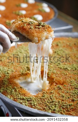 Traditional Arabian kunafa, konafa with Cream and Cheese with pistachio nuts on top
 Royalty-Free Stock Photo #2091432358