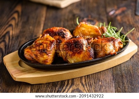 crispy roasted chicken pieces with roasted potatoes and salad Royalty-Free Stock Photo #2091432922