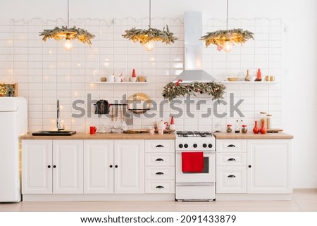 Winter cozy kitchen with red decorations, christmas utensils Royalty-Free Stock Photo #2091433879