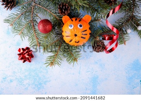 Tiger from orange. Year of the Tiger - 2022 Chinese Zodiac. Christmas composition with place for text.