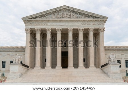 Front view of the iconic building of United States Supreme Court at day time, Washington DC, USA. The concept of judicial branch of American political system Royalty-Free Stock Photo #2091454459