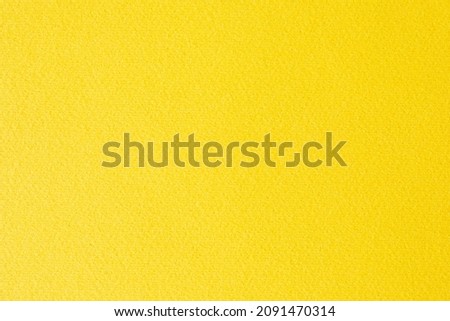 Yellow paper background or texture. Thick fibrous cardboard. Copy space