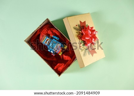 A studio photo of an open Christmas gift