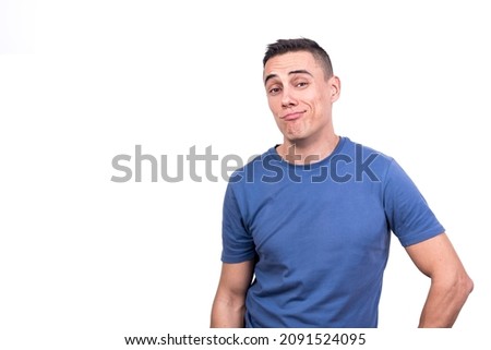 Man looking at the camera with cocky expression Royalty-Free Stock Photo #2091524095