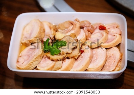 Famous Shanghai Chinese cuisine known as drunken chicken is a dish of steamed chicken that has been soaked in Shaoxing wine and served cold as an appetizer. Royalty-Free Stock Photo #2091548050