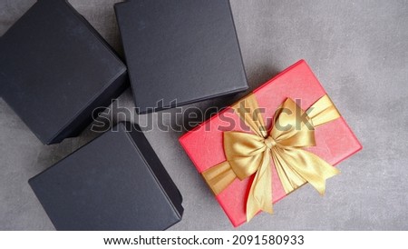 An elegant and neatly arranged gift box on a table on a gray background. new year and christmas concept. valentine gift concept.
