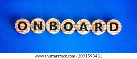 Onboard and onboarding symbol. The concept word Onboard on wooden circles. Beautiful blue background, copy space. Business onboard and onboarding concept.
