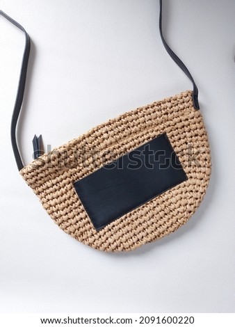 Knitting or crocheting summer bag in white background. Isolated background. Minimalist and aesthetic photography