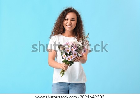 Beautiful woman with flowers on color background. International Women's Day celebration