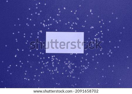 Mockup of a business card or postcard with a star ornament in the trendy Very Peri color. Flat style, planning concept, top view