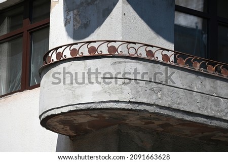 balcony of an old building with a rounded corner