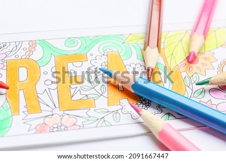 Cute bookmark with pencils on white background, closeup