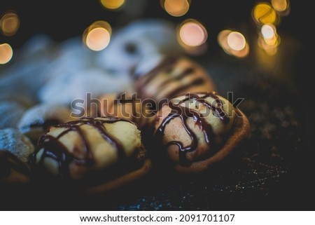 Moody picture of traditional Christmas bakeries on a place with bokeh effect and cozy atmosphere.