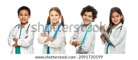 Group of positive multi-ethnic kids wearing medical uniforms and stethoscopes. Medical healthcare and support, concept of future doctors occupation Royalty-Free Stock Photo #2091720199