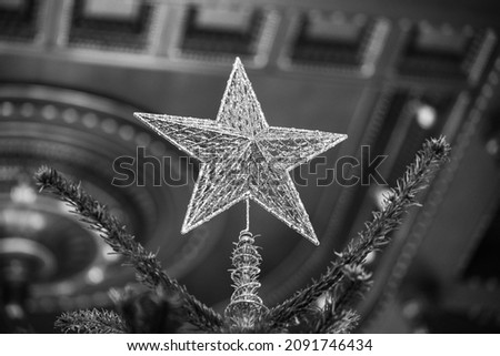 star. the star in the Christmas tree. symbol of the winter holidays that sits on top of the Christmas tree. detail. photo inside.