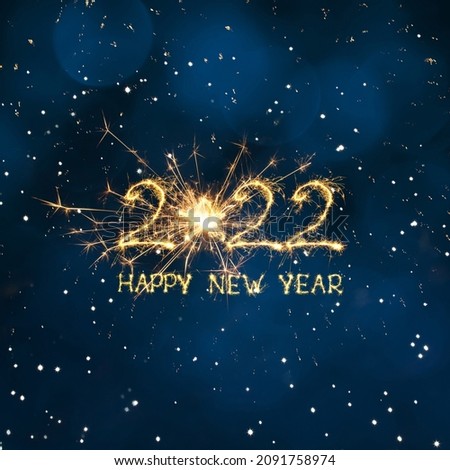 Greeting card Happy New Year 2022. Beautiful Square holiday web banner or billboard with creative Golden sparkling text Happy New Year 2022 written sparklers on festive blue background