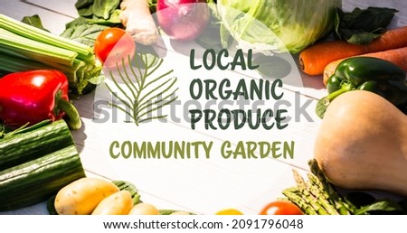 Local organic produce community garden symbol over fresh vegetables arrange on table. digital composite of healthy food and sign.