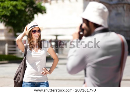 Couple of turists taking picture in the city