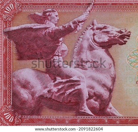 Close up of Obverse of 100 dinars paper bill issued by Yugoslavia, that shows Horseman with sward