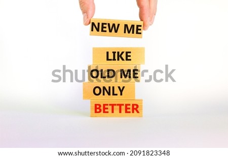 Better new me symbol. Wooden blocks with words 'new me like old me only better'. Beautiful white background, copy space. Businessman hand. Business and better new me concept.