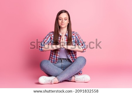 Full size photo of young pretty woman arms together meditate om practice isolated over pink color background