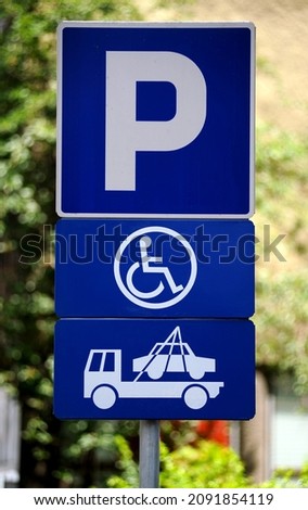 vehicle removal service in case of taking the disabled parking space sign close up photo
