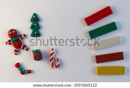 plasticine homemade figures, symbols of Christmas and New Year on a white background