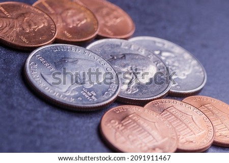 Pile of Golden coin, silver coin, copper coin, quarters, nickels, dimes, pennies, fifty cent piece and dollar coins. Various USA coins, American coins for business, money, financial coins and economy