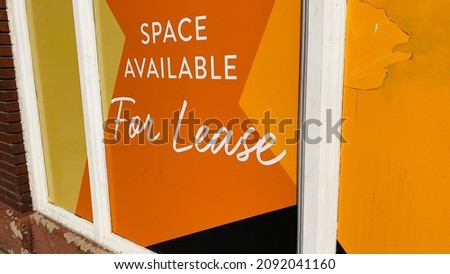 Space Available For Lease Sign on Retail and Restaurant Building Storefront