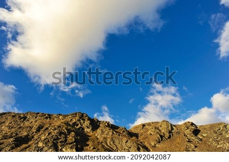 Hill and blue sky with sunlight and cloudy 