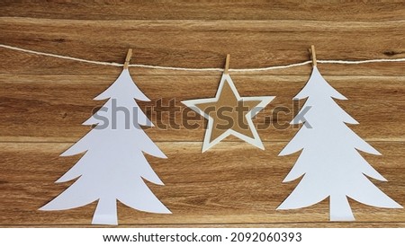 Handmade Christmas card on rustic wood background.