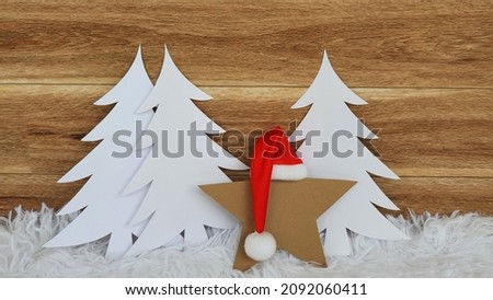 Handmade Christmas card on wooden background.