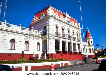 old build of british style with red color and white and blue sky in the oro state of mexico Royalty-Free Stock Photo #2092068016
