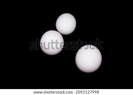 Eggs on black background with selective focus
