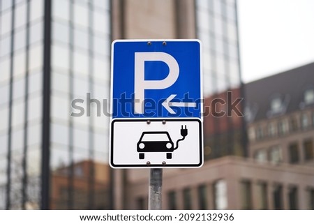Parking sign for electric cars. Parked electric cars can be charged.                             
