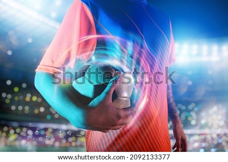 Soccer player ready to play with soccerball at the stadium