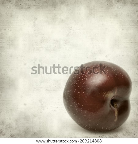 textured old paper background with plums