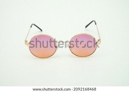 Pink stylish eyeglasses front view on white background