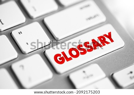 Glossary - an alphabetical list of words relating to a specific subject with explanations, text button on keyboard Royalty-Free Stock Photo #2092175203