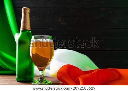 Bottle of beer against flag of Ireland