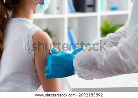 Doctor preparing for vaccination of patient in hospital