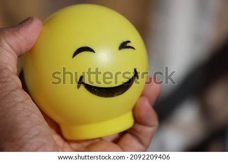 happy face toy, concept of happiness