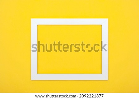 Picture frame white on yellow background