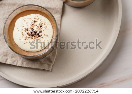 Italian chocolate and coffee mousse dessert semifreddo - half-frozen ice cream with whipped cream and cocoa powder in small glasses Royalty-Free Stock Photo #2092226914